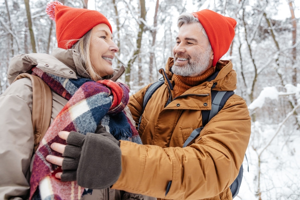 Things to Do in New England: a winter couple enjoying the snow