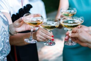 Hands toasting with champagne glasses