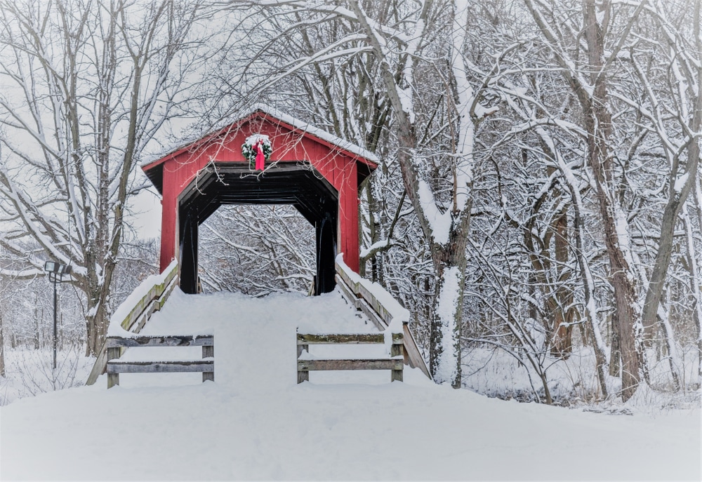 A beautiful covered bridge landscape in the winter, one of the best things to do in Brattleboro while enjoying your Vermont getaway