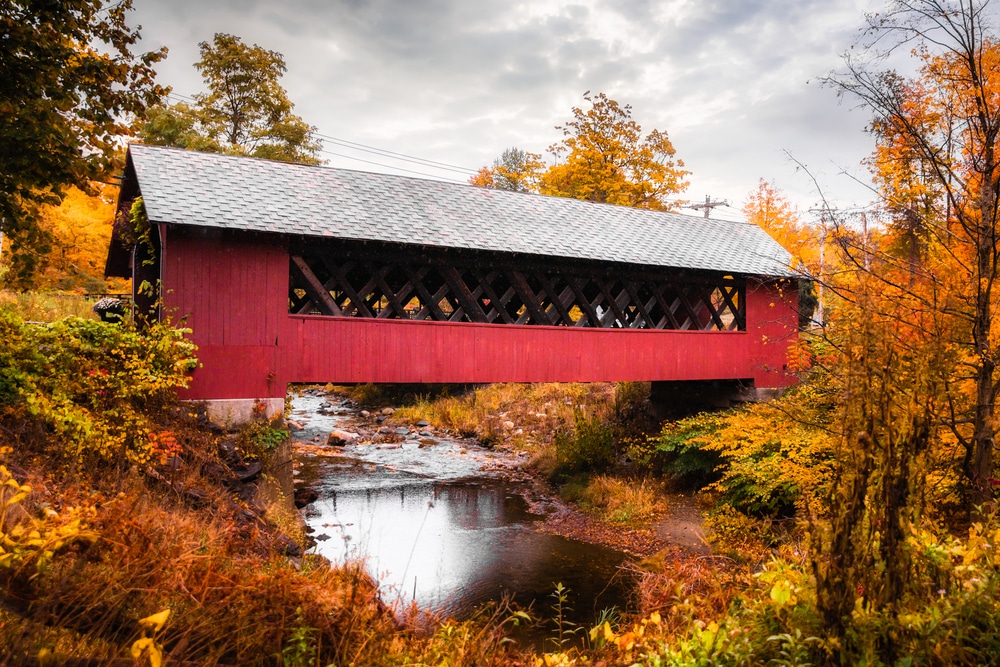Seeing Vermont covered bridges surrounded by fall foliage is one of the best things to do in Vermont in the fall