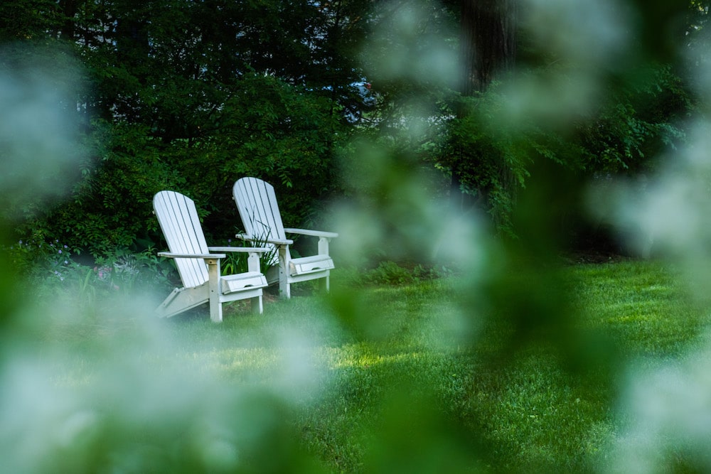 Two adirondack chairs in the back yard of our Vermont Bed and Breakfast - a great place to unwind after visiting Fort Dummer State Park