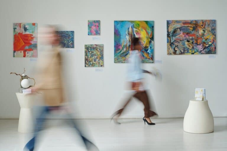 blurred image of people walking through a museum like the Brattleboro Museum and Art Center