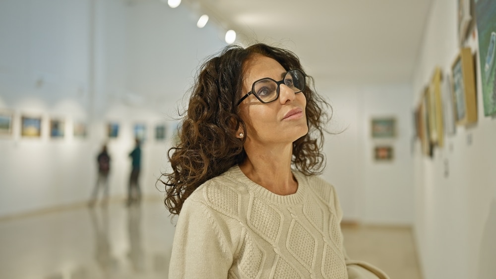 woman admiring the exhibits at the Brattleboro Museum and Art Center