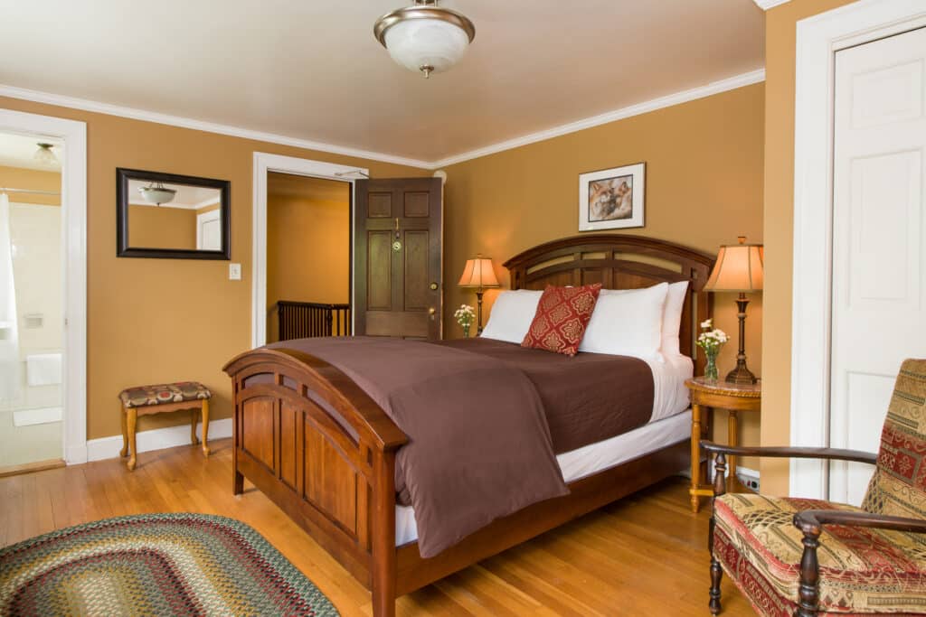 Don't Miss a Performance at the Vermont Jazz Center 8 The deluxe queen bed in the Mountain View Room at Inn on utney Road, the best Vermont Bed and Breakfast.